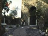 Malaga: Lily is waiting at the entrance to the to the Alcazaba, the fortress built on the top of the hill overlooking the city, with a view of the coast.